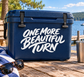 Vinyl decal reading "ONE MORE BEAUTIFUL TURN" in white script on dark blue