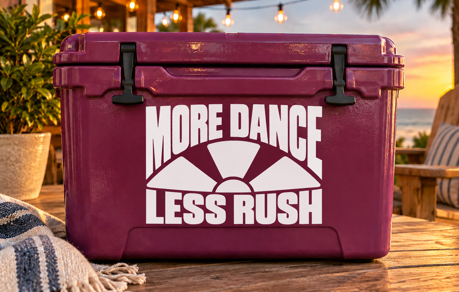 Purple cooler with black-and-white vinyl decal: “MORE DANCE” and “LESS RUSH”