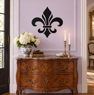 Black fleur-de-lis vinyl decal for wall, centered on a panel door.