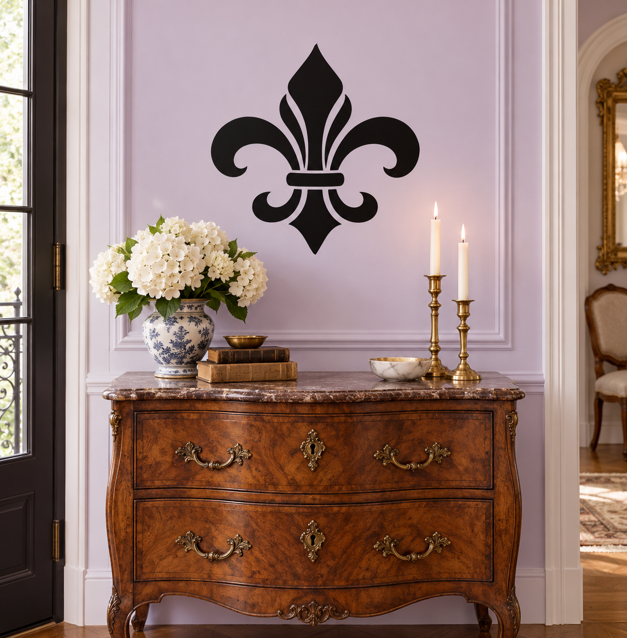 Black fleur-de-lis vinyl decal for wall, centered on a panel door.