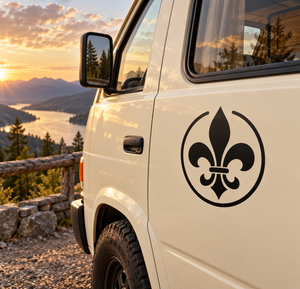 Open-circle fleur-de-lis vinyl decal, black crest on a vehicle door panel