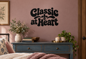 Vinyl decal with “Classic at Heart” lettering and fleur-de-lis accent, black