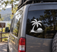 Vinyl palm tree sunset decal on car window, black silhouette with sun and waves
