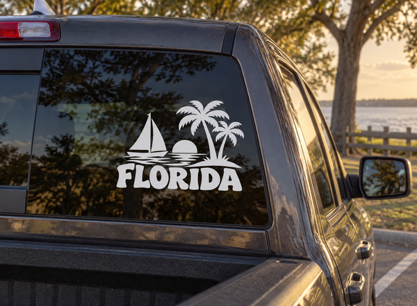 Florida tropical sailboat vinyl decal with palm trees and FLORIDA lettering on a car window