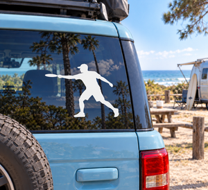 Vinyl decal of a man throwing a flying disc, white silhouette on a surface