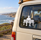 White vinyl decal of seated person on bench for car window