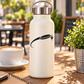Vinyl decal of black flying disc with comet trail and starburst on white bottle
