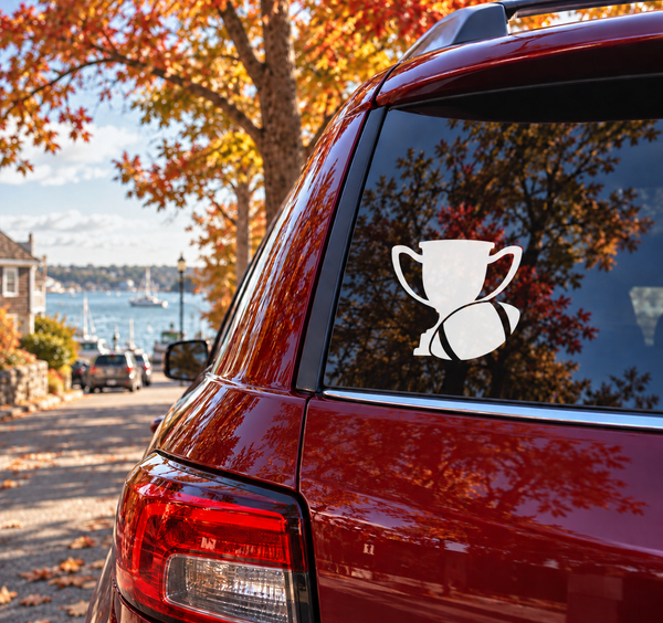 White trophy and football vinyl decal on car rear window