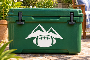 White vinyl decal of mountains and a football in an eye shape on a green case