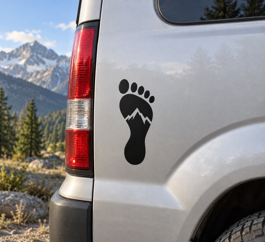 Black footprint vinyl decal with mountain outline on car door