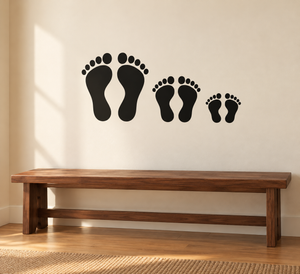 Family footprint vinyl decal with four black foot prints in different sizes