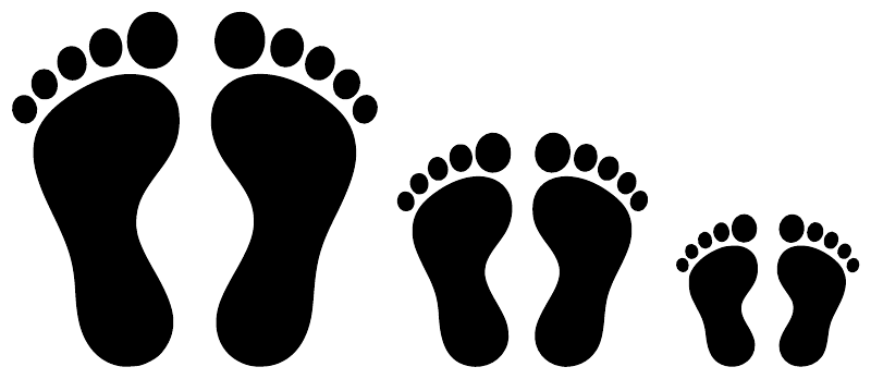 Close-up of four black vinyl footprints in varying sizes for wall decal