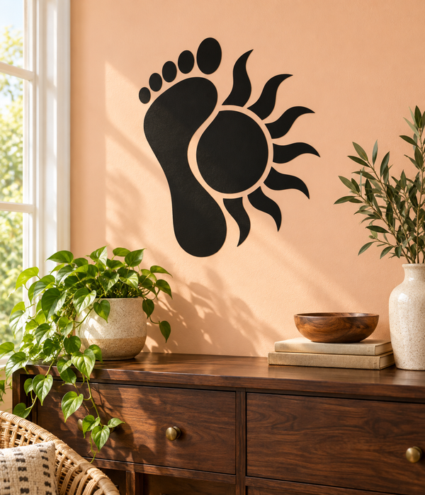 Black vinyl footprint and sun decal with circular center and spiky rays