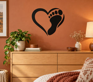 Black heart-shaped vinyl decal with dog paw prints and footprint
