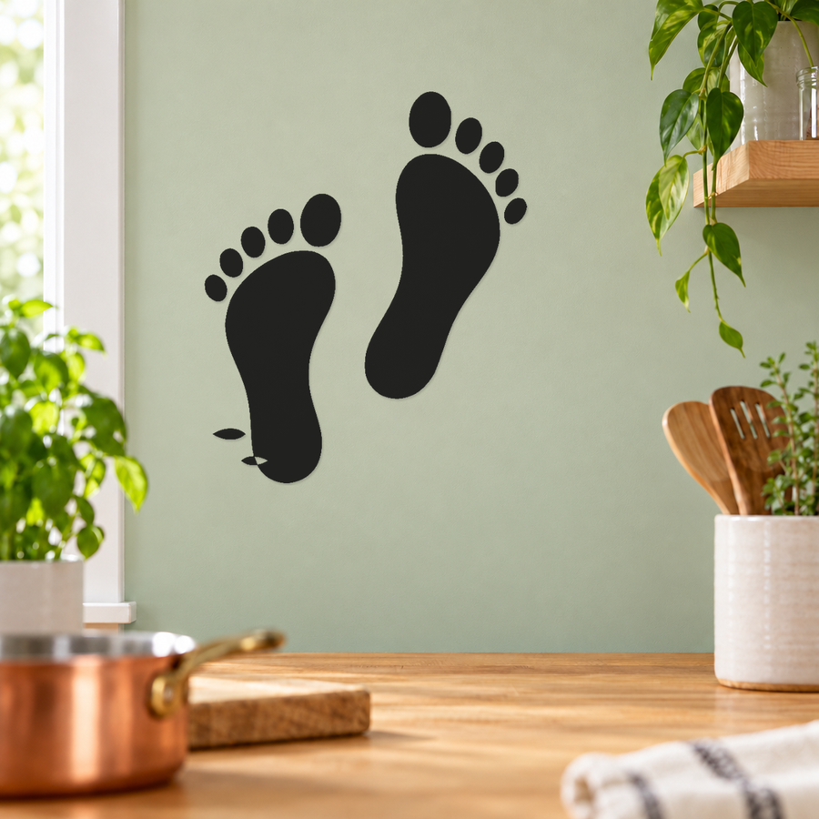 Black mirrored barefoot footprint vinyl decal set on wall with two footprints