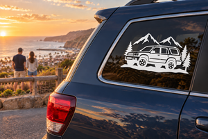 White vinyl decal of mountains and SUV on a car window