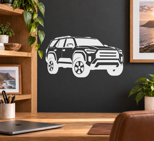 White and black SUV vinyl decal with low front angle view