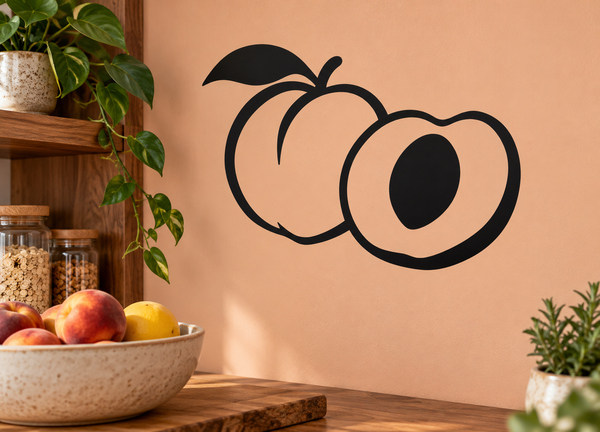 Peach vinyl decal of two stylized peaches with leaf and black pit, outlined in black