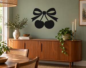 Black vinyl bow decal with two cherry shapes, two-lobed ribbon and centered knot