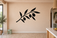 Black olive branch vinyl wall decal with curved stem, leaves, and round olives