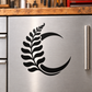 Black vinyl decal of a crescent moon with leafy branch design