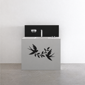 Black swallow ribbon vinyl decal with flying bird and leaf vines on cabinet front