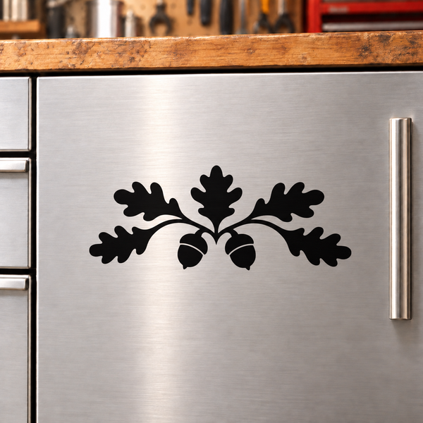 Black acorn oak crest vinyl decal on stainless cabinet door
