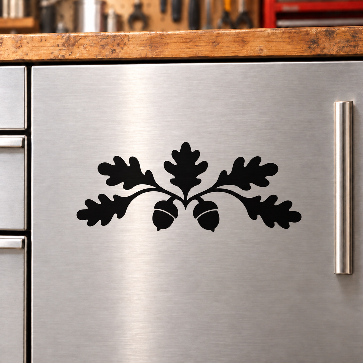 Black acorn oak crest vinyl decal on stainless cabinet door