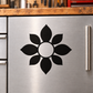 Petal medallion vinyl decal with black flower shape and white center on metal surface