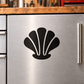 Black seashell vinyl cabinet decal with white highlights on cabinet door