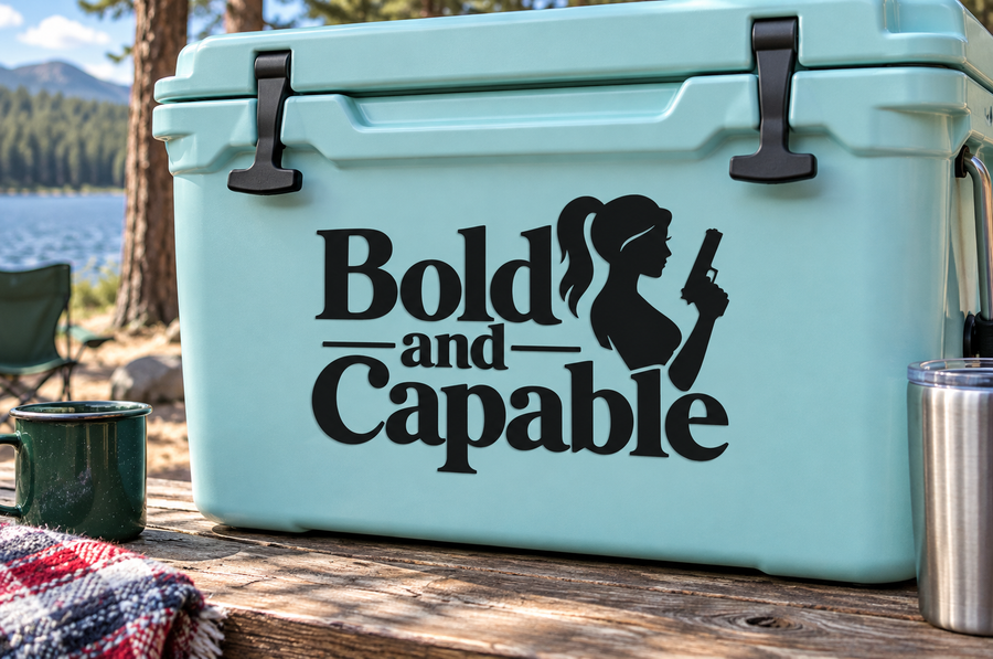 Bold and Capable vinyl decal with girl silhouette and rifle, on light blue cooler