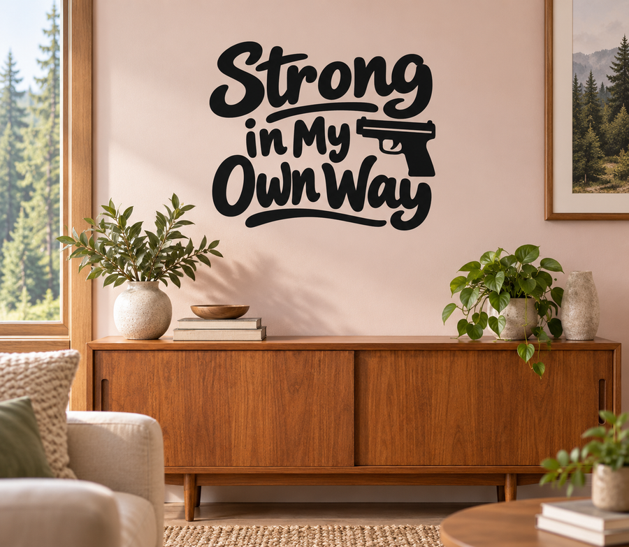 Vinyl decal with bold script text "Strong in My Own Way" and rifle icon