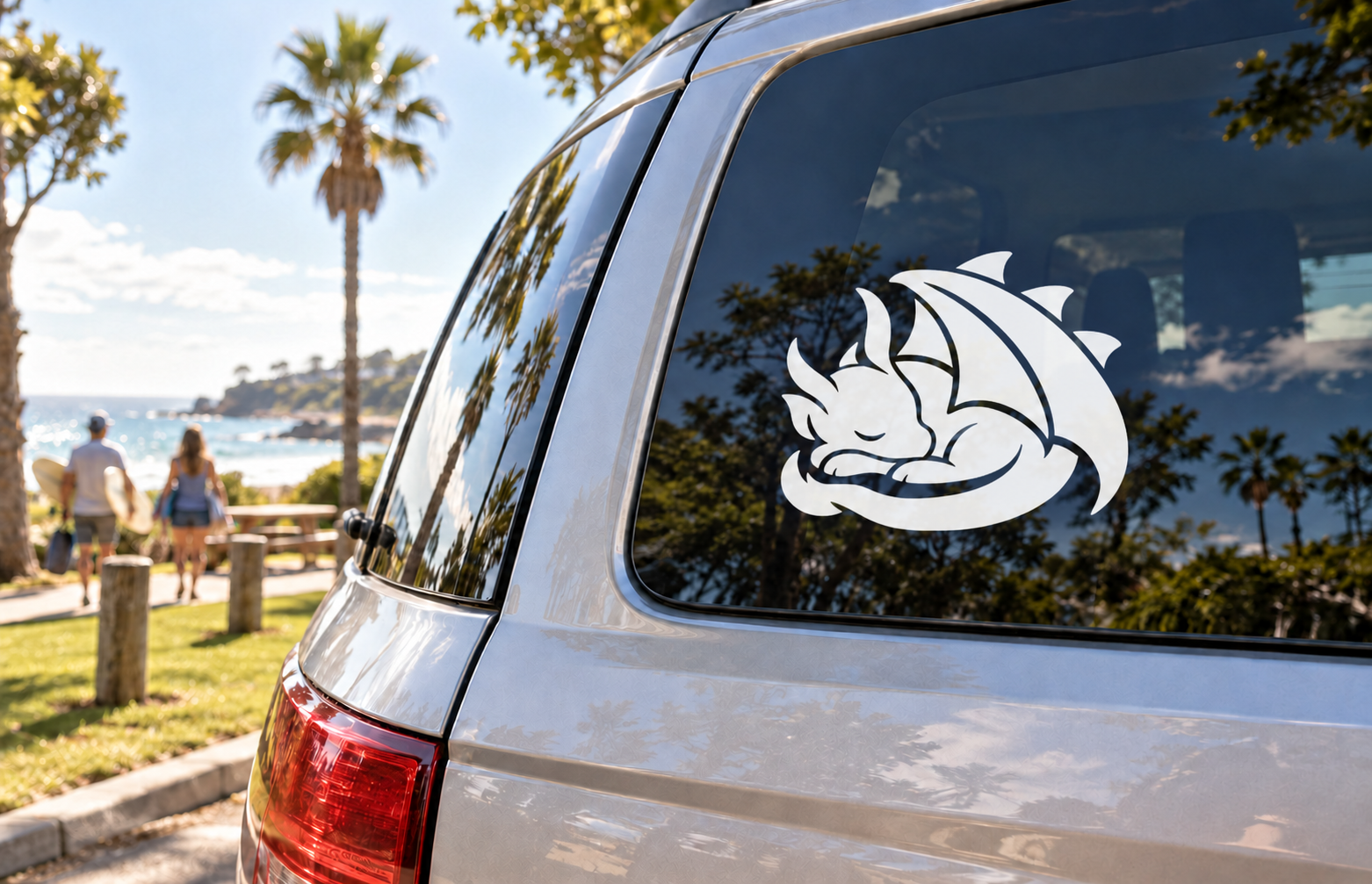 Glow-in-the-dark vinyl dragon decal: white dreaming dragon on dark window