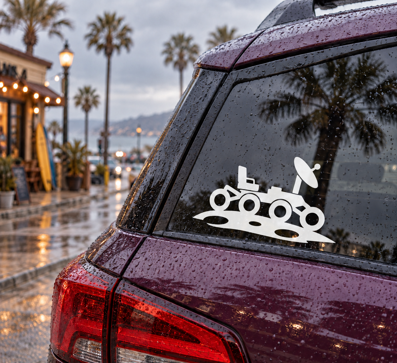 Glow-in-the-dark vinyl rover decal, white planet explorer design on car window