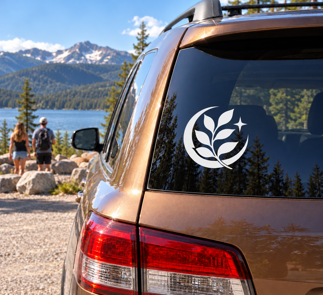 Glow-in-the-dark vinyl decal: moon with leaf sprig on car window