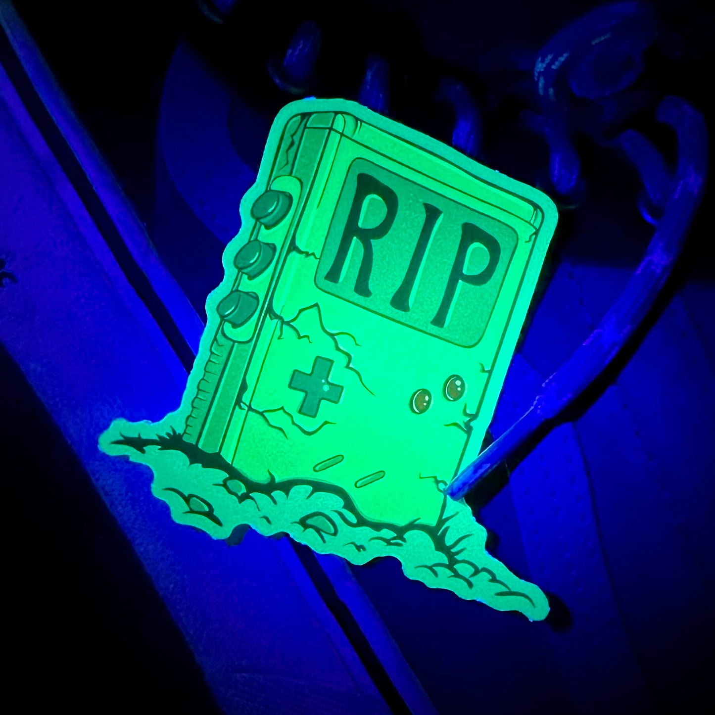 glow in the dark custom vinyl sticker featuring a game tombstone illustration