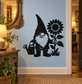 Black gnome gardener vinyl decal holding a watering can beside a sunflower