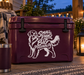 White golden retriever vinyl decal on maroon surface with 'Small Paws Big Personality' text