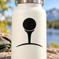 Black golf tee icon vinyl decal on pale surface, circular head with tee silhouette