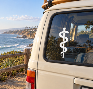 White serpent-staff vinyl decal on a car window