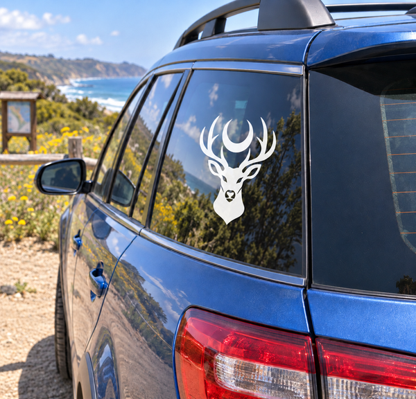 Stag moon vinyl decal on car rear window, white antlers and crescent moon