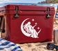White night crest vinyl decal with a goddess silhouette holding a star and sparkles.