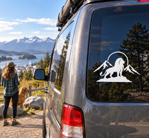 Vinyl mountain lion decal with wings and mountains, applied on a vehicle window