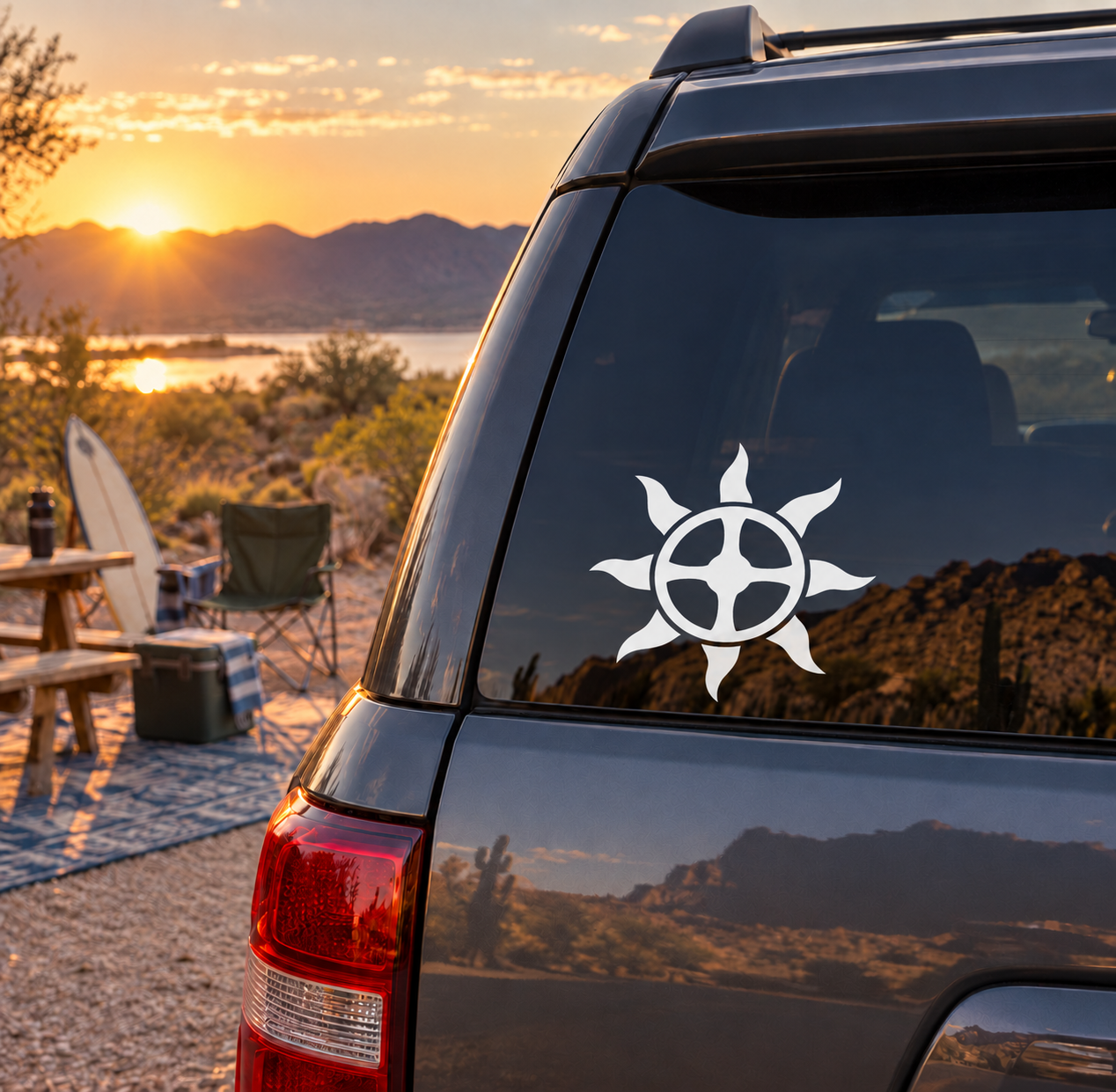 Helios sun wheel vinyl decal on dark car window, white sun and cross-like spokes