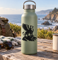 Vinyl decal of a black griffin on a light green bottle