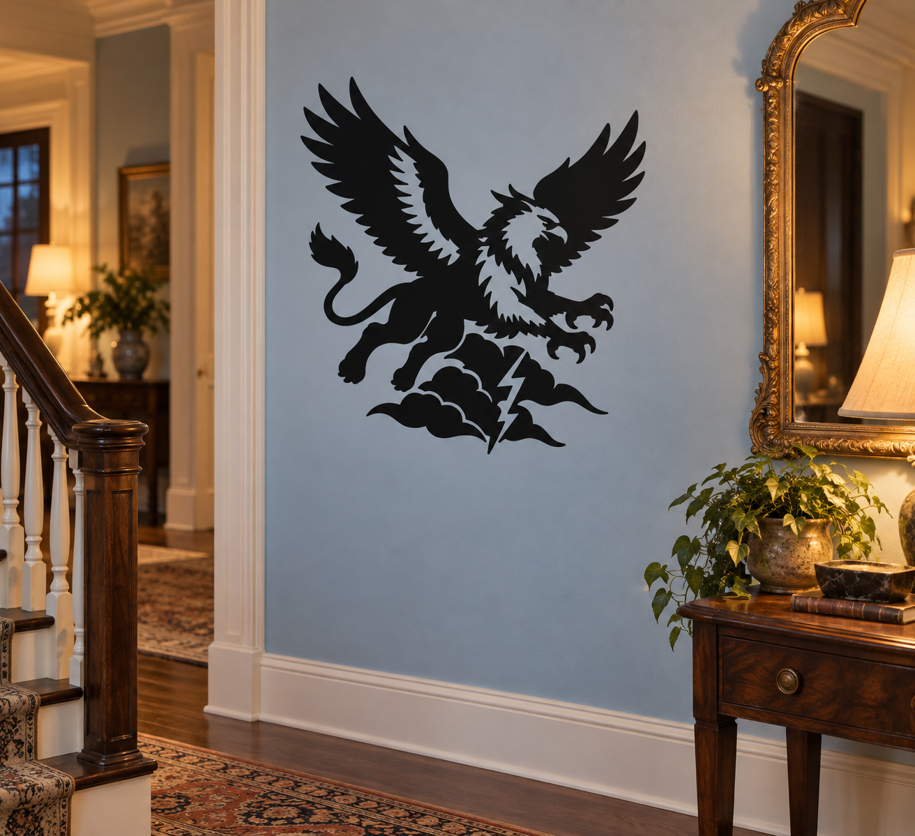 Black flying griffin vinyl decal with wings spread and storm cloud details