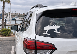 Pommel horse vinyl decal on rear window of a white car