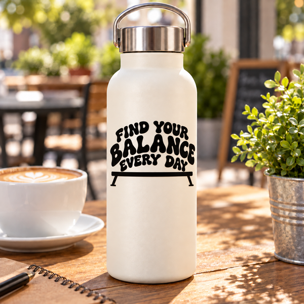 White water bottle with black “Find Your Balance Every Day” vinyl decal