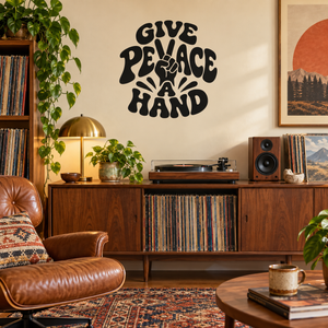 Black vinyl decal reading 'Give Peace a Hand' in hand-lettered text