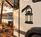 Black vinyl decal of a hand holding a lantern with flame